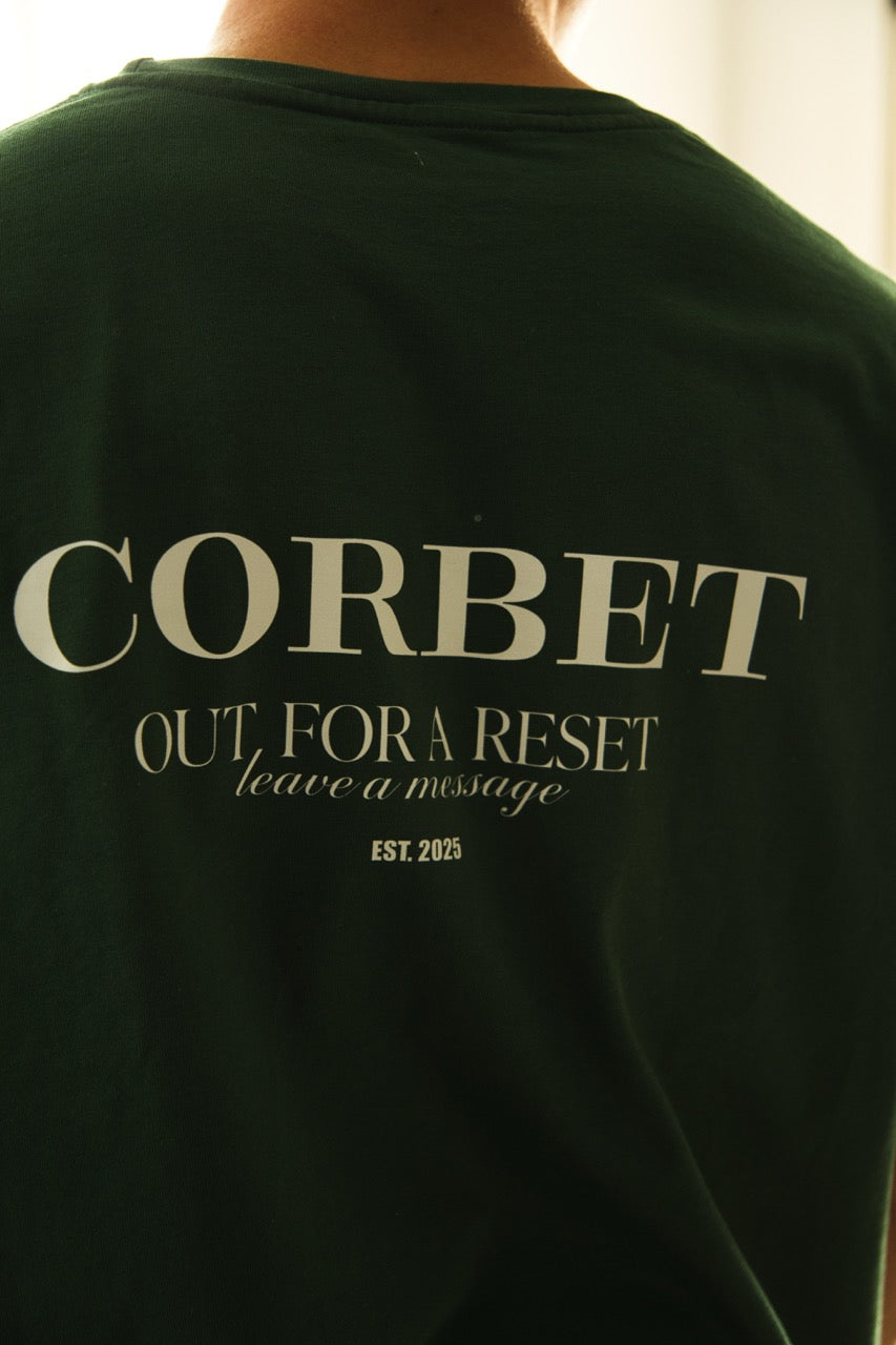 Green t-shirt with 'CORBET' text on the back